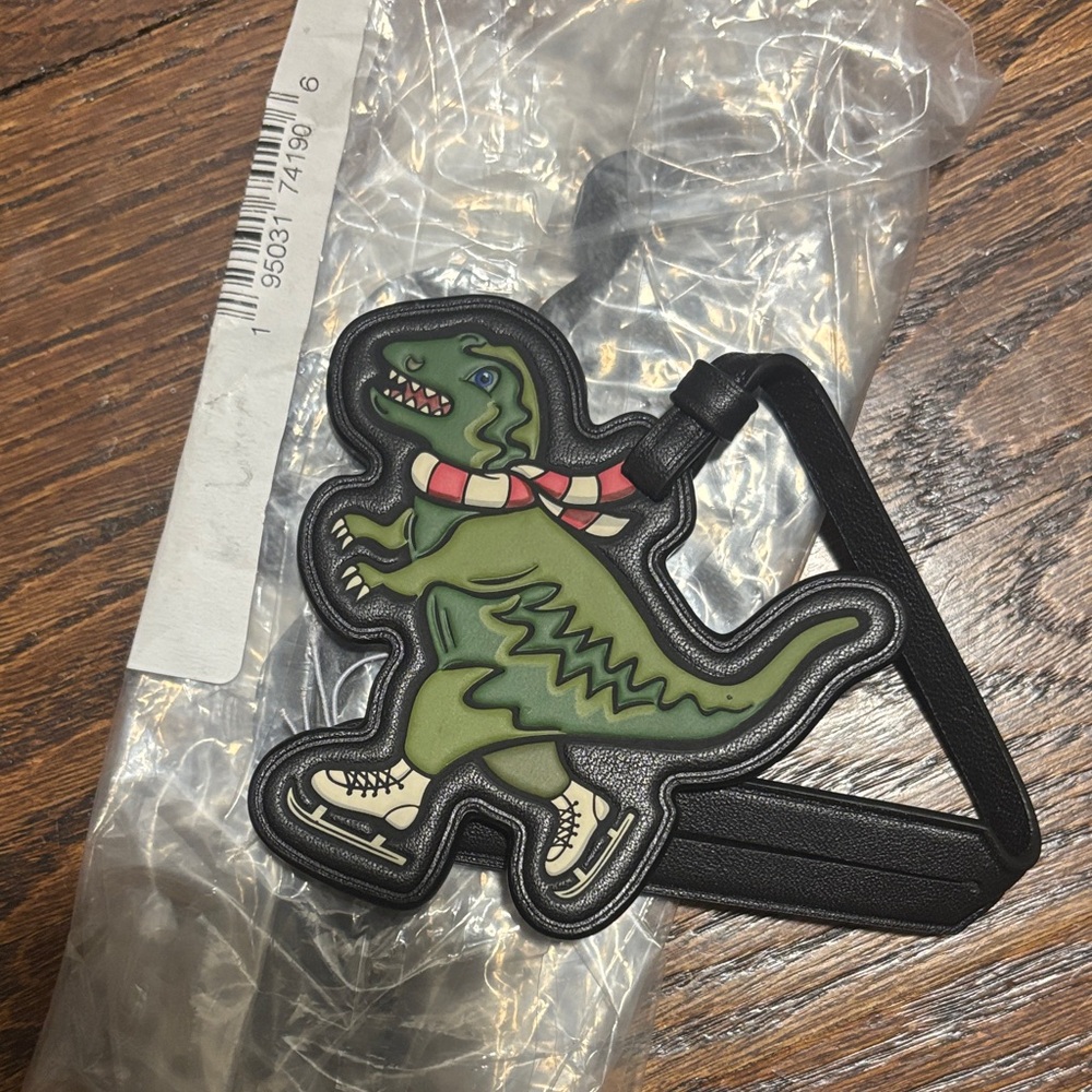 Brand new coach dinosaur luggage tag